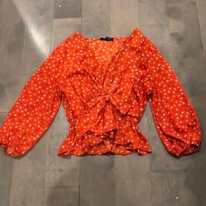 Medium red with white flower blouse by Stella Luce that is perfect for summer!